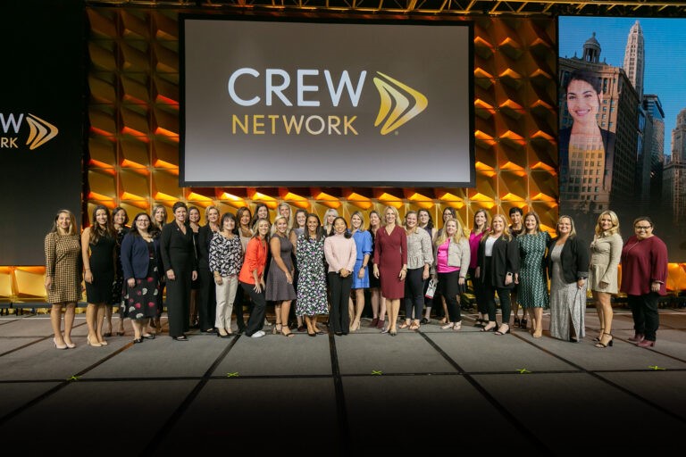 CREW Network large group on stage for pictures