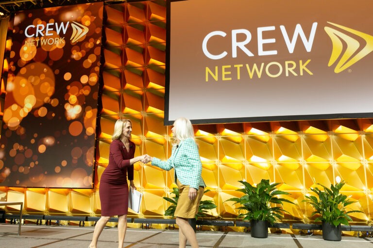 CREW Network speakers shaking hands