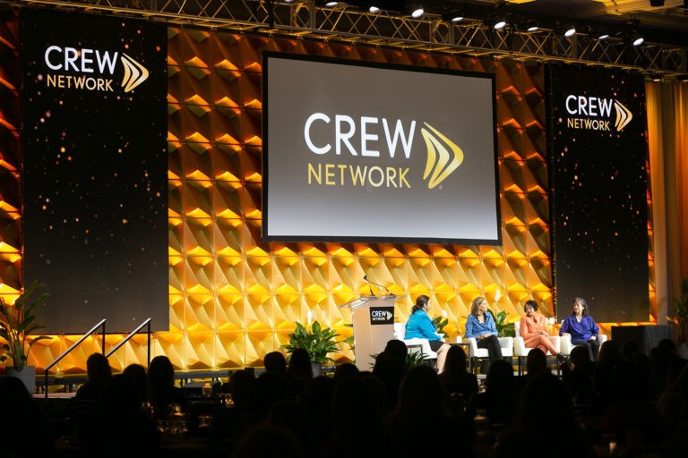 CREW Network four females discussing on stage
